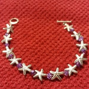 Silver starfish with purple faceted crystals